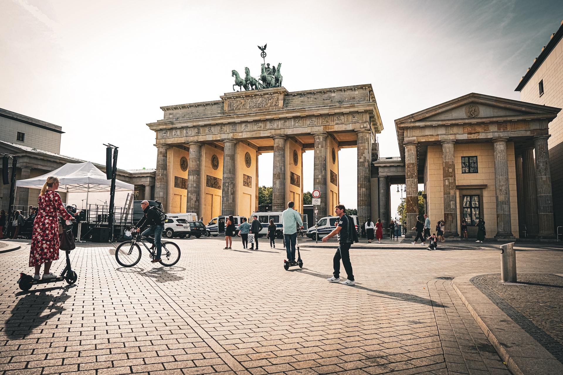 People walking around outside on the streets of Berlin.